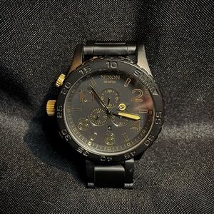 Nixon Black and Gold Watch with Chronograph
